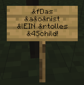 Der Schild-Editor in Minecraft mit vier Zeilen: „&fDas“, „&a&o&nist“, „&lEIN &rtolles“ und „&4Schild!“.